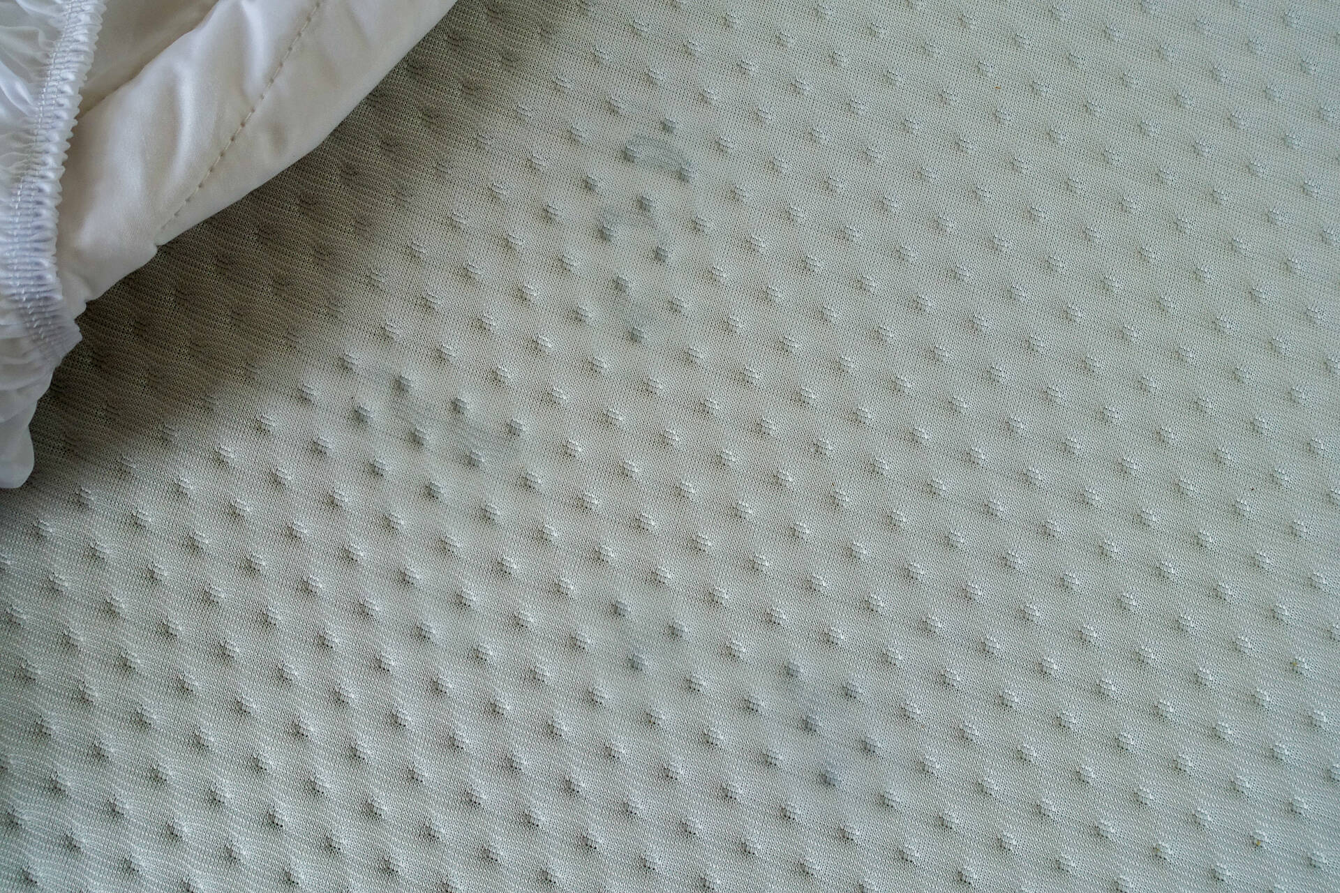 water on mattress cover